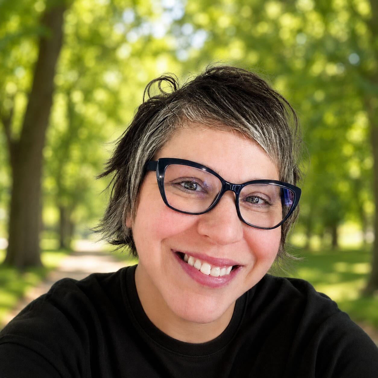 photo of Renee Wall smiling in a park